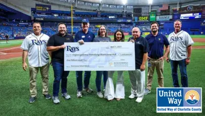 Charlotte County representatives holding million dollar donation check from Rays Baseball Foundation