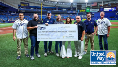 Charlotte County representatives holding million dollar donation check from Rays Baseball Foundation